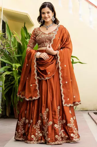 Appealing Rust Orange Zari and Sequins, and Thread Embroidered Rangoli silk Indian wedding Designer lehenga choli