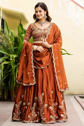 Appealing Rust Orange Zari and Sequins, and Thread Embroidered Rangoli silk Indian wedding Designer lehenga choli