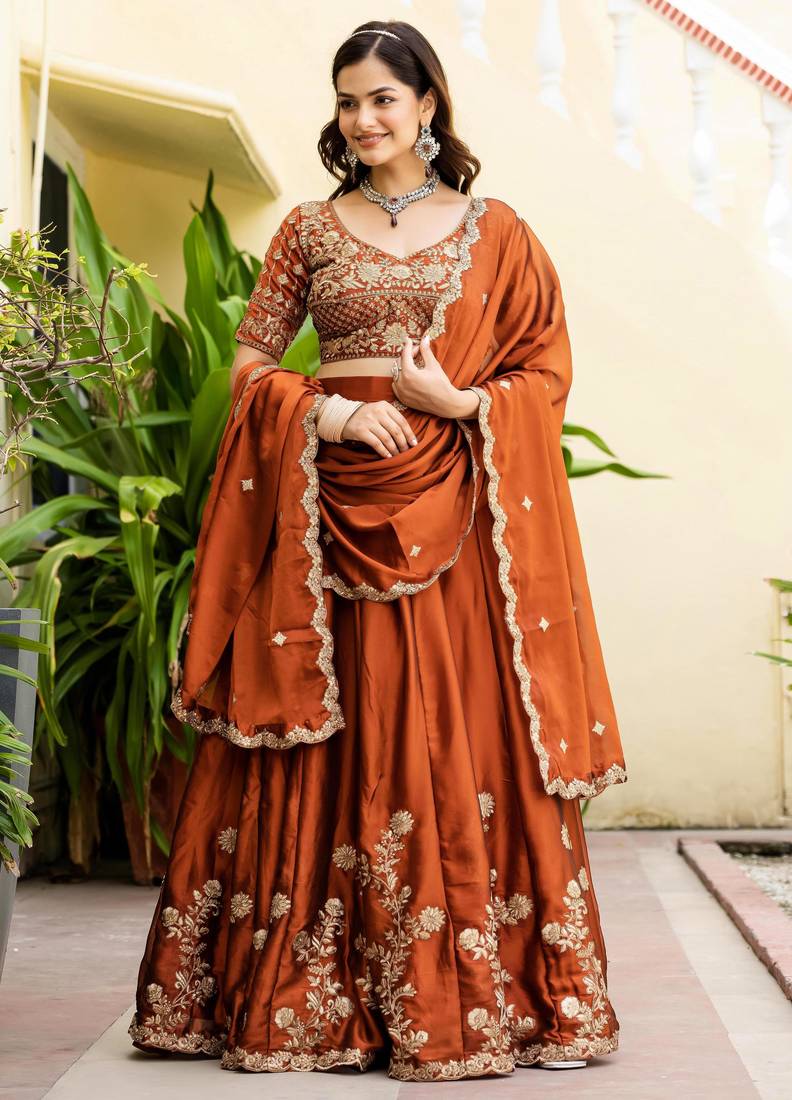 Appealing Rust Orange Zari and Sequins, and Thread Embroidered Rangoli silk Indian wedding Designer lehenga choli