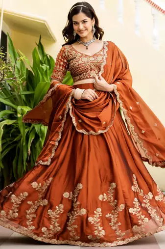 Appealing Rust Orange Zari and Sequins, and Thread Embroidered Rangoli silk Indian wedding Designer lehenga choli