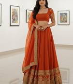 Alluring Fenta Orange Zari and Sequins, and Thread Embroidered Faux Georgette Indian wedding Designer lehenga choli