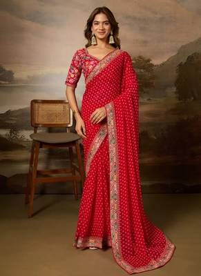 Red embriodered lace georgette bollywood saree with blouse piece. 1