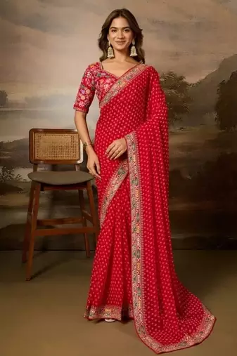 Red embriodered lace georgette bollywood saree with blouse piece.