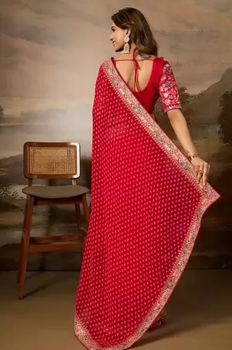Red embriodered lace georgette bollywood saree with blouse piece.