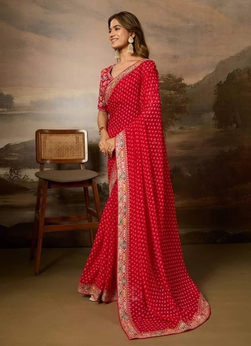 Red embriodered lace georgette bollywood saree with blouse piece.