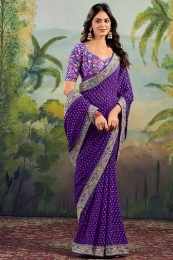 Purple embriodered lace georgette bollywood saree with blouse piece.