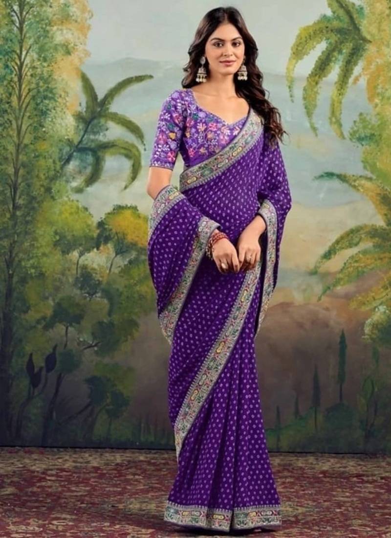 Purple embriodered lace georgette bollywood saree with blouse piece.