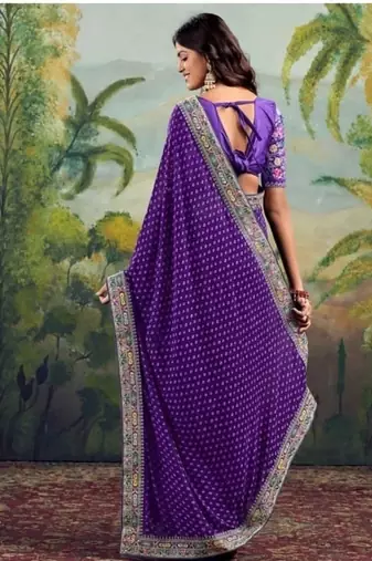 Purple embriodered lace georgette bollywood saree with blouse piece.