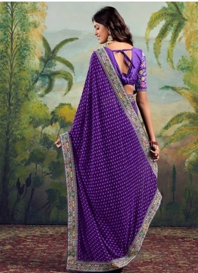 Purple embriodered lace georgette bollywood saree with blouse piece.