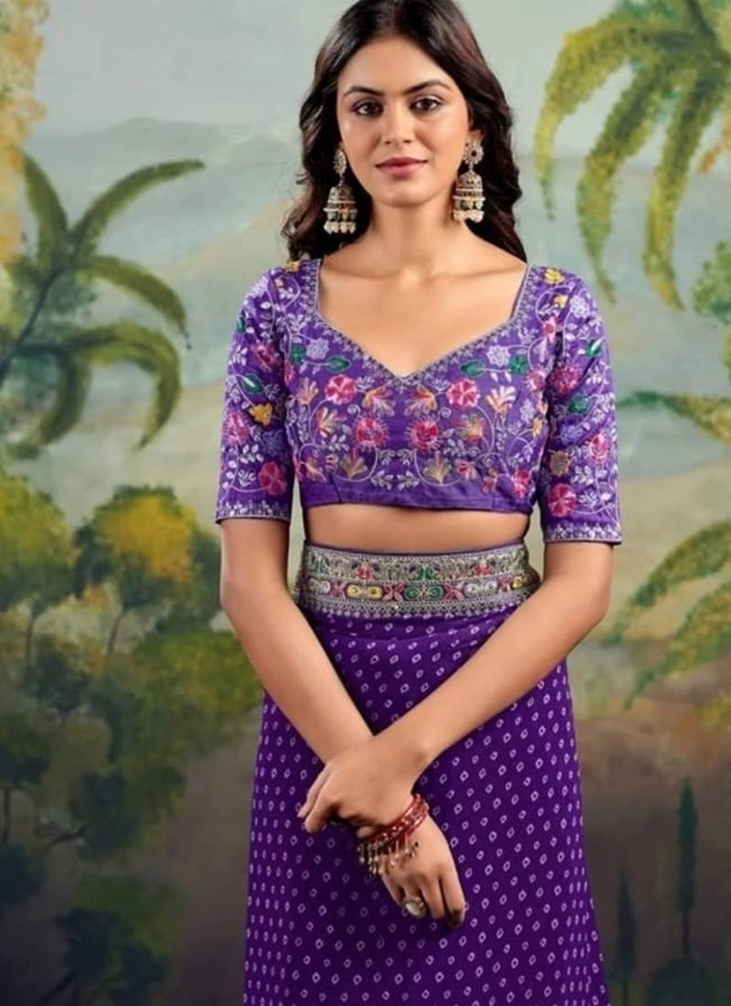 Purple embriodered lace georgette bollywood saree with blouse piece.