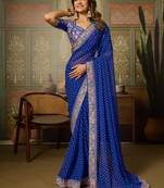 Blue embriodered lace georgette bollywood saree with blouse piece.