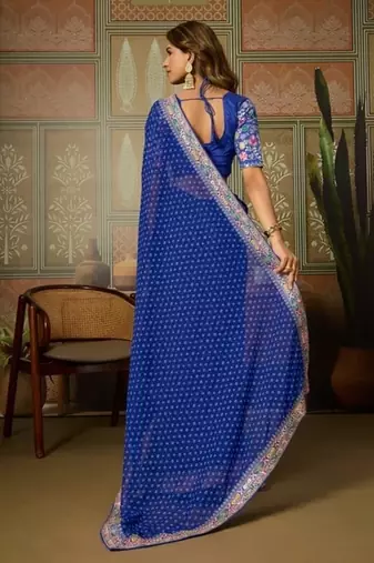 Blue embriodered lace georgette bollywood saree with blouse piece.