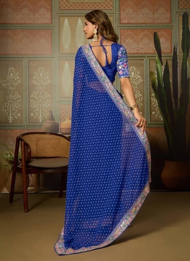 Blue embriodered lace georgette bollywood saree with blouse piece.