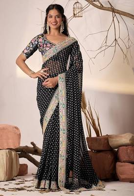 Black embriodered lace georgette bollywood saree with blouse piece. 1