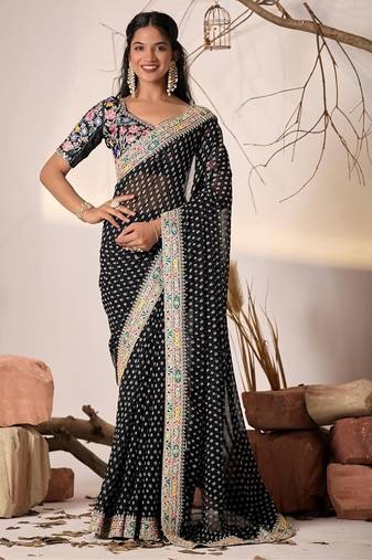 Black embriodered lace georgette bollywood saree with blouse piece.