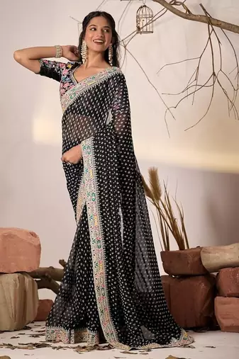 Black embriodered lace georgette bollywood saree with blouse piece.
