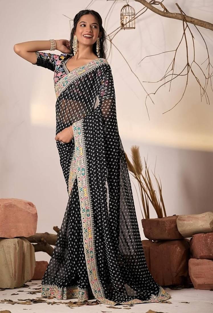 Black embriodered lace georgette bollywood saree with blouse piece.