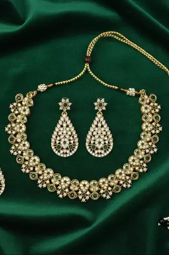 Gold plated traditional floral necklace set with earrings & maangtikka for women