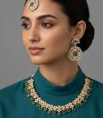 Gold plated traditional kundan-style necklace set with earrings & maangtikka