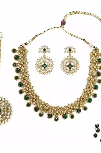 Gold plated traditional kundan-style necklace set with earrings & maangtikka
