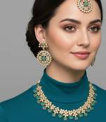 Gold plated traditional kundan-style necklace set with earrings & maangtikka