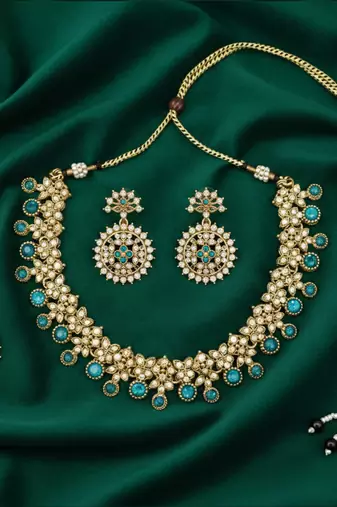 Gold plated traditional kundan-style necklace set with earrings & maangtikka