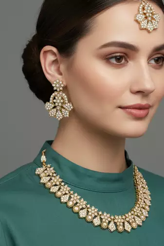 Gold plated traditional kundan-style necklace set with earrings & maangtikka