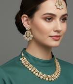 Gold plated traditional kundan-style necklace set with earrings & maangtikka