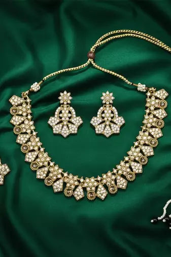 Gold plated traditional kundan-style necklace set with earrings & maangtikka