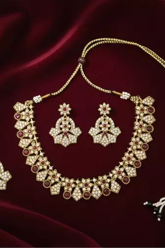 Gold plated traditional kundan-style necklace set with earrings & maangtikka