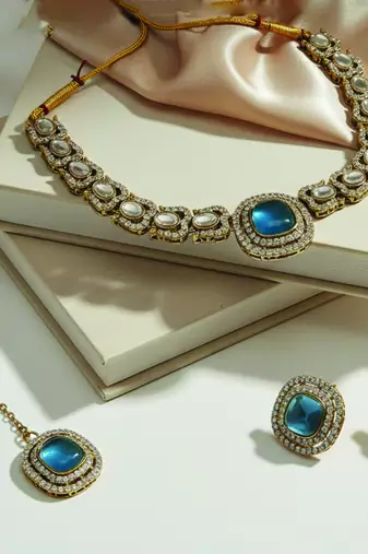 Gold plated traditional kundan-style necklace set with earrings & maangtikka