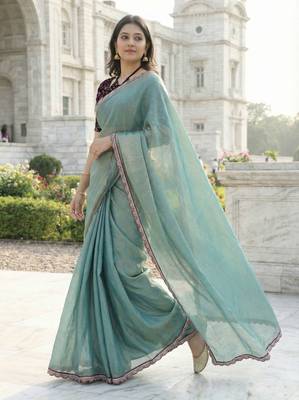 green fendy silk saree with contrast lace border 1