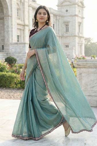 Green color plain with contrast matching embroidered lace premium fendy silk saree with unstitched blouse