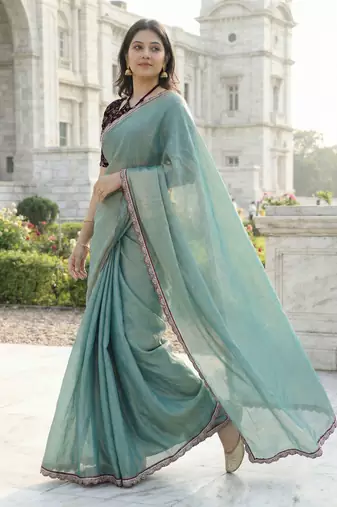 Green color plain with contrast matching embroidered lace premium fendy silk saree with unstitched blouse