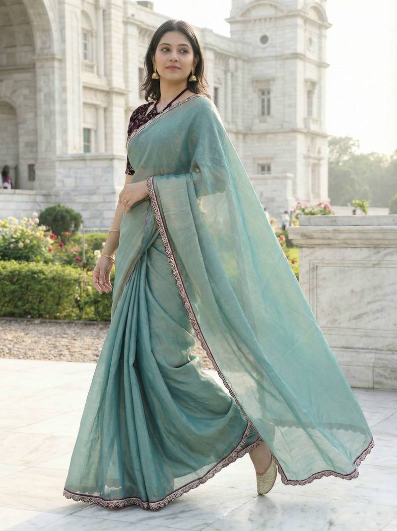 Green color plain with contrast matching embroidered lace premium fendy silk saree with unstitched blouse