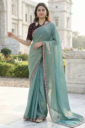 green fendy silk saree with contrast lace border