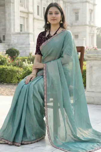 green fendy silk saree with contrast lace border
