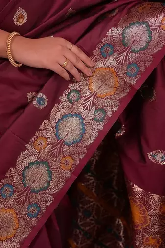 Maroon color colorfull woven border zari work soft silk blend saree