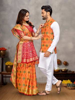 Elegant men's kurta with jacquard silk koti & women's orange saree set 1
