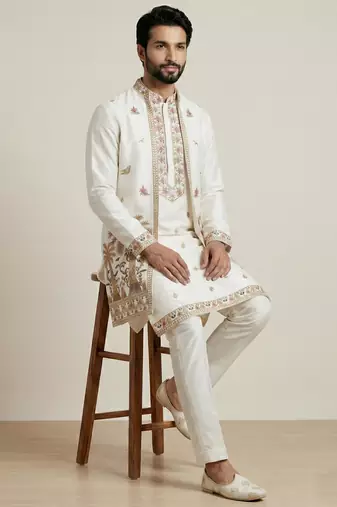 white doniyar shartin kurta set with long embroidered jacket