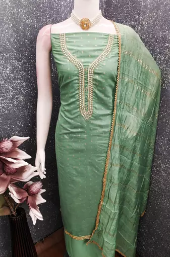 Green color chanderi butti fabric beautiful embroidered suit