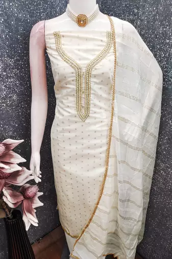 Off white color chanderi butti fabric beautiful embroidered suit