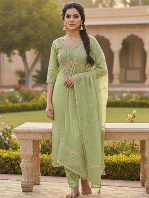 Green color chanderi butti fabric beautiful embroidered suit 1