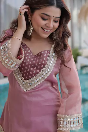 Pink color beautful embroidered punjabi suit with matching purse