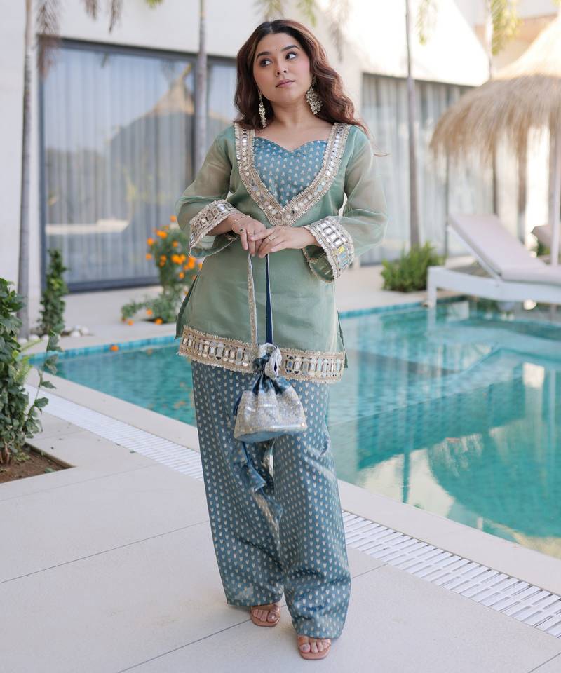 Sky blue color beautful embroidered punjabi suit with matching purse