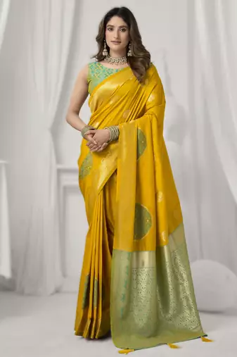 Yellow soft silk saree with elegant fancy pom-pom pallu
