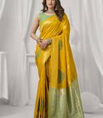 Yellow soft silk saree with elegant fancy pom-pom pallu