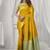 Yellow soft silk saree with elegant fancy pom-pom pallu