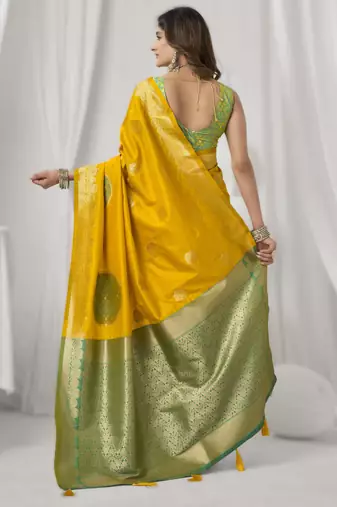 Yellow soft silk blend saree with elegant fancy pom-pom pallu