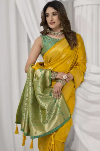 Yellow soft silk blend saree with elegant fancy pom-pom pallu
